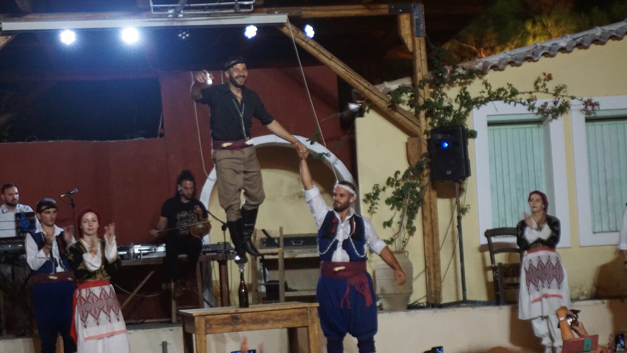 Traditional Cretan costumes and art during the night celebration